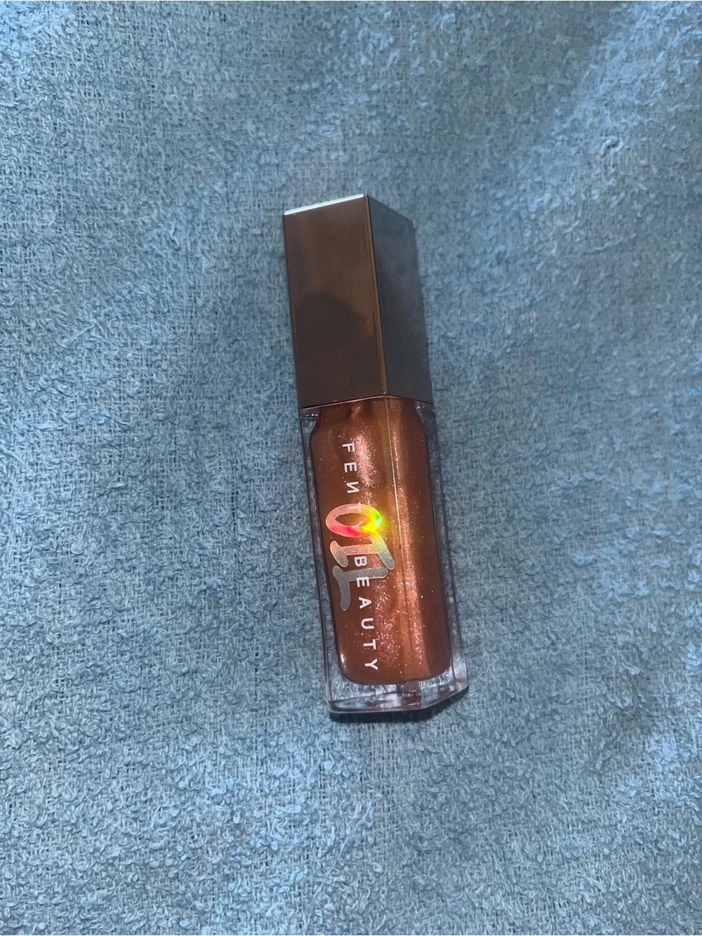 Fenty Beauty Shimmering Copper-Bronze Lip Gloss